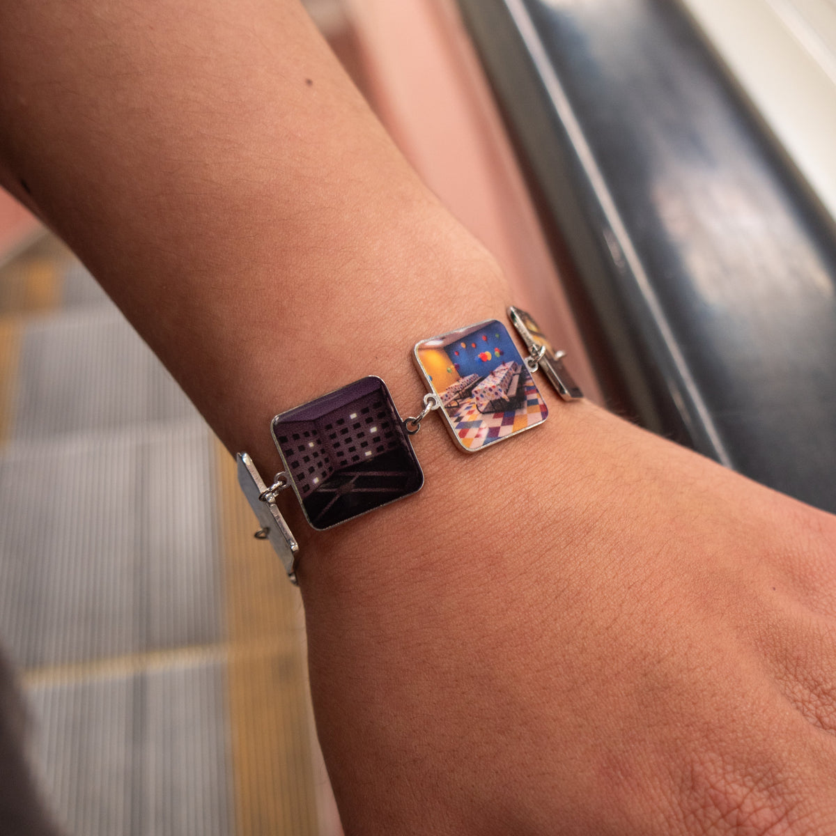 Backrooms Bracelet on wrist showing Level 188 The Dark and party room charms in UV-printed stainless steel